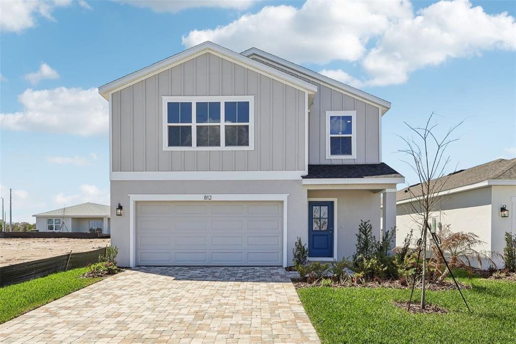 Front exterior of a new home in Willowbrook North, Winter Haven, FL, highlighting curb appeal (Image 1). Front exterior of a new home in Willowbrook North, Winter Haven, FL, highlighting curb appeal (Image 1).