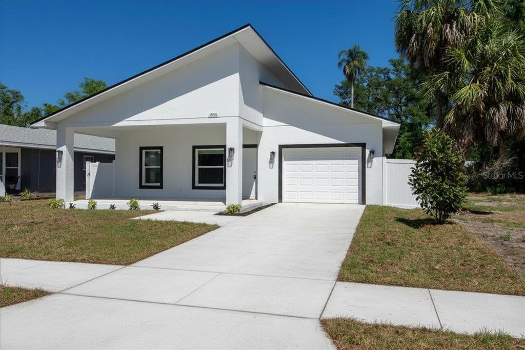 Front exterior of a new home in , St. Petersburg, FL, highlighting curb appeal (Image 1). Front exterior of a new home in , St. Petersburg, FL, highlighting curb appeal (Image 1).