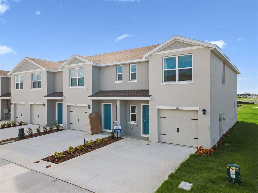 Front exterior of a new home in , Haines City, FL, highlighting curb appeal (Image 1). Front exterior of a new home in , Haines City, FL, highlighting curb appeal (Image 1).