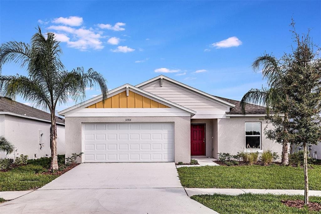 Front exterior of a new home in Scenic Terrace, Haines City, FL, highlighting curb appeal (Image 1). Front exterior of a new home in Scenic Terrace, Haines City, FL, highlighting curb appeal (Image 1).