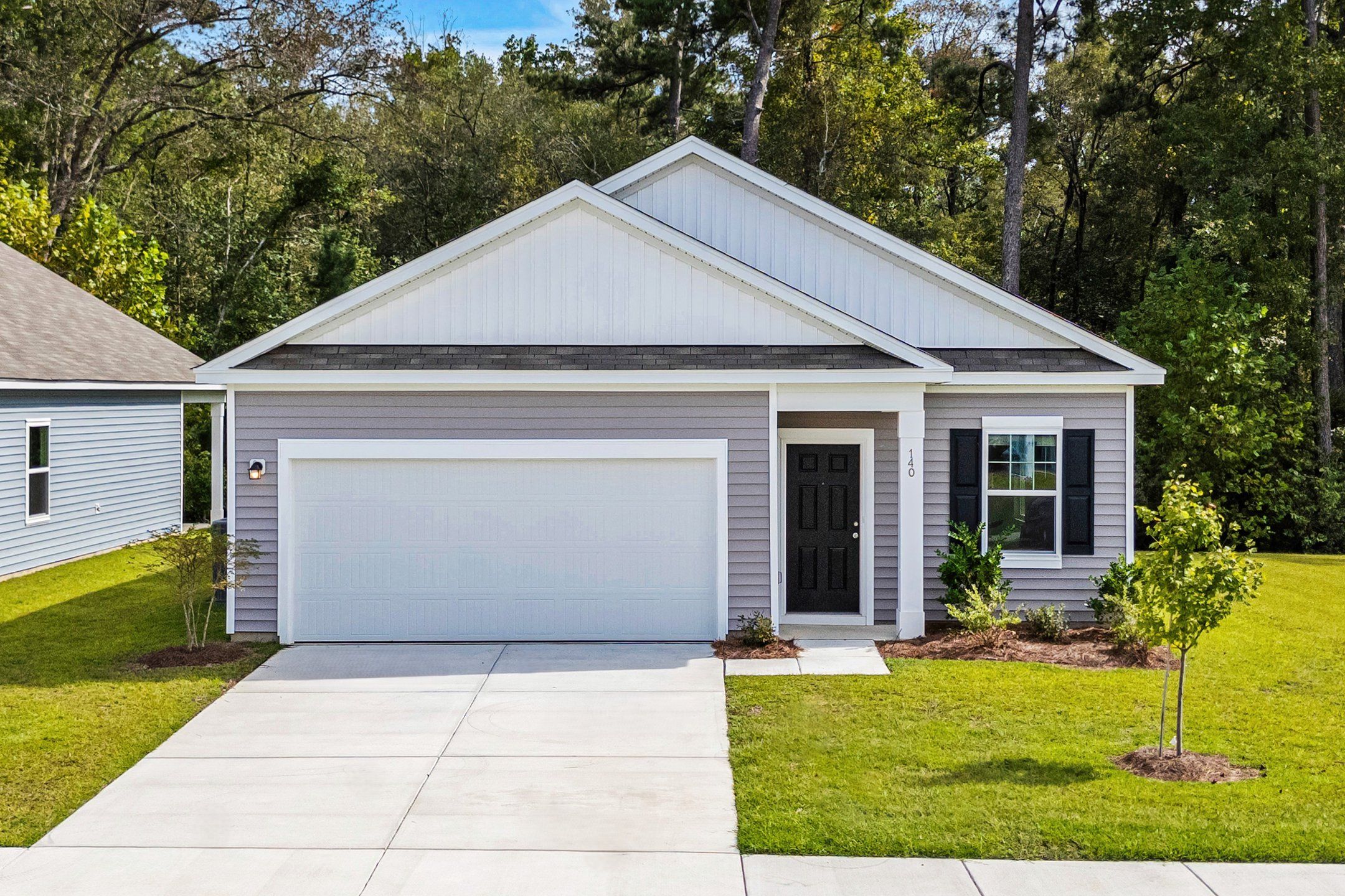 Front exterior of a new home in Andalusia, Loris, SC, highlighting curb appeal (Image 1).
