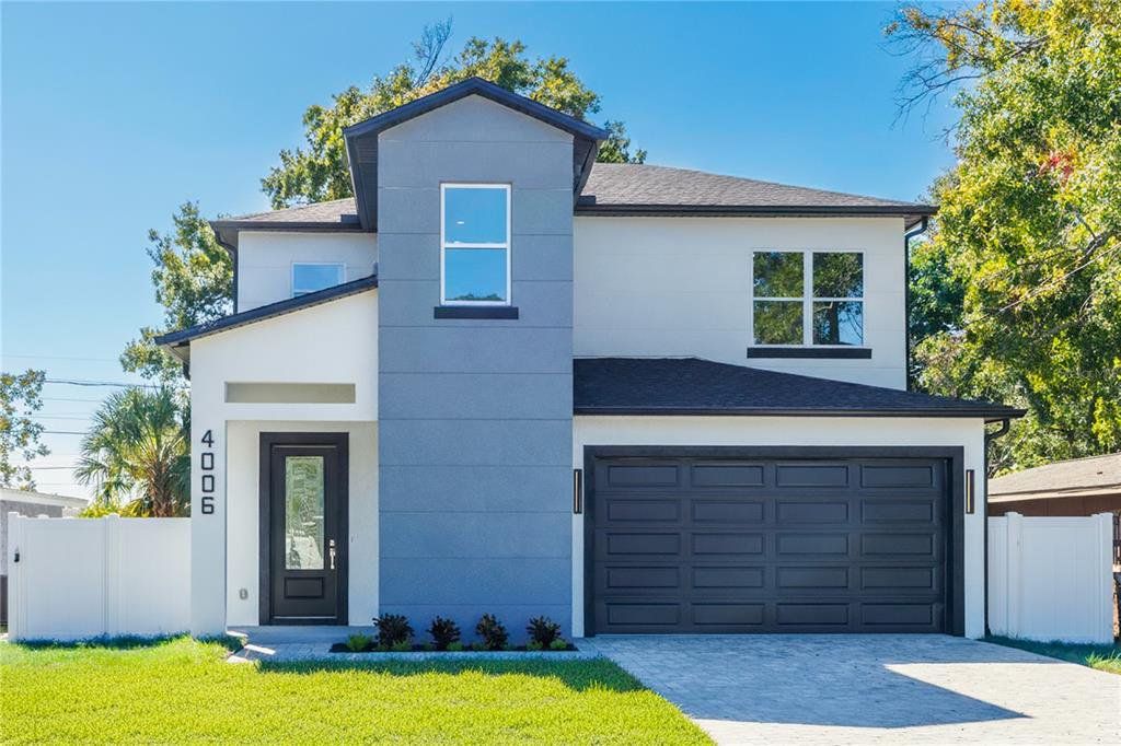 Front exterior of a new home in , Tampa, FL, highlighting curb appeal (Image 1). Front exterior of a new home in , Tampa, FL, highlighting curb appeal (Image 1).