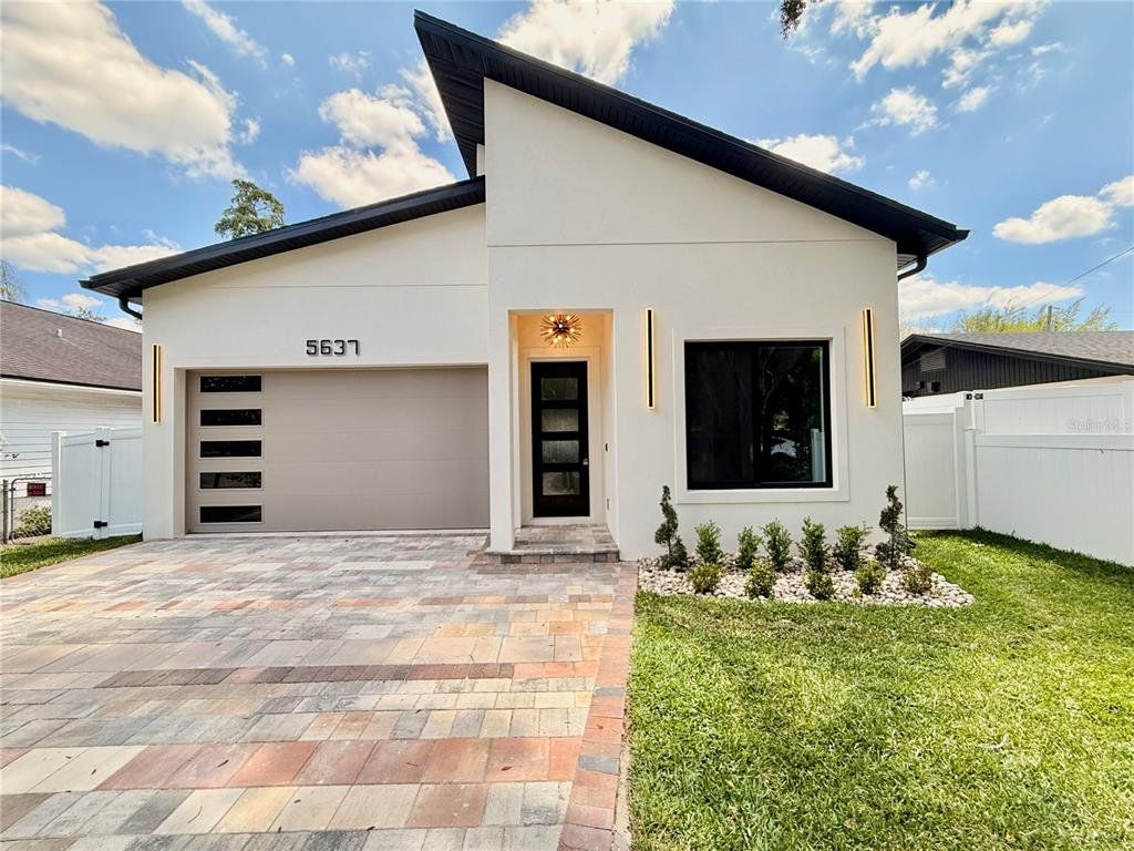 Front exterior of a new home in , Orlando, FL, highlighting curb appeal (Image 1). Front exterior of a new home in , Orlando, FL, highlighting curb appeal (Image 1).