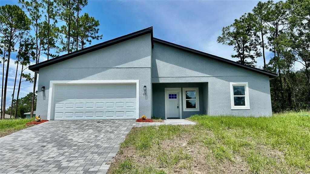 Front exterior of a new home in , Ocala, FL, highlighting curb appeal (Image 1). Front exterior of a new home in , Ocala, FL, highlighting curb appeal (Image 1).