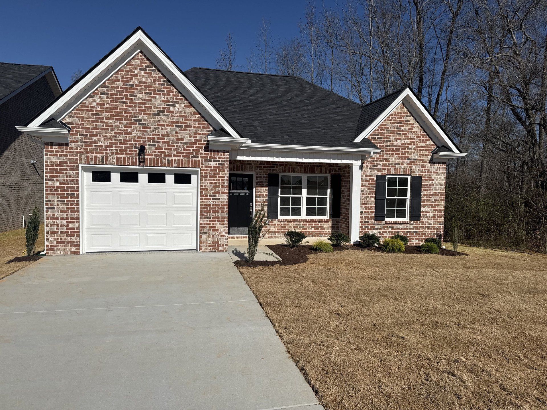 Front exterior of a new home in Legacy Preserve, Tullahoma, TN, highlighting curb appeal (Image 1). Front exterior of a new home in Legacy Preserve, Tullahoma, TN, highlighting curb appeal (Image 1).