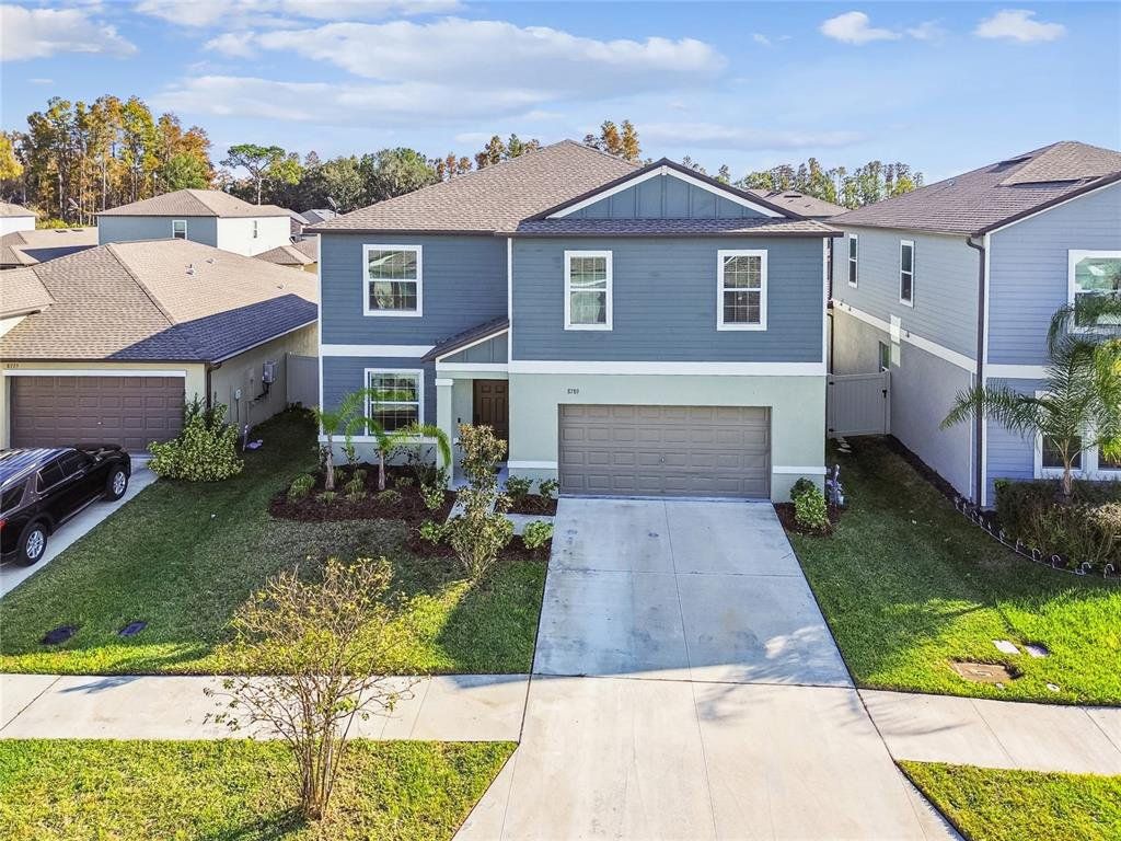 Front exterior of a new home in , Land O' Lakes, FL, highlighting curb appeal (Image 1). Front exterior of a new home in , Land O' Lakes, FL, highlighting curb appeal (Image 1).