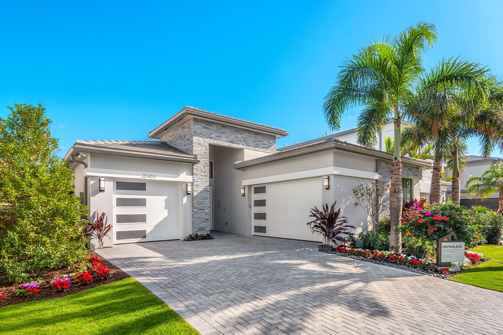 Front exterior of a new home in Lotus Edge, Boca Raton, FL, highlighting curb appeal (Image 1). Front exterior of a new home in Lotus Edge, Boca Raton, FL, highlighting curb appeal (Image 1).