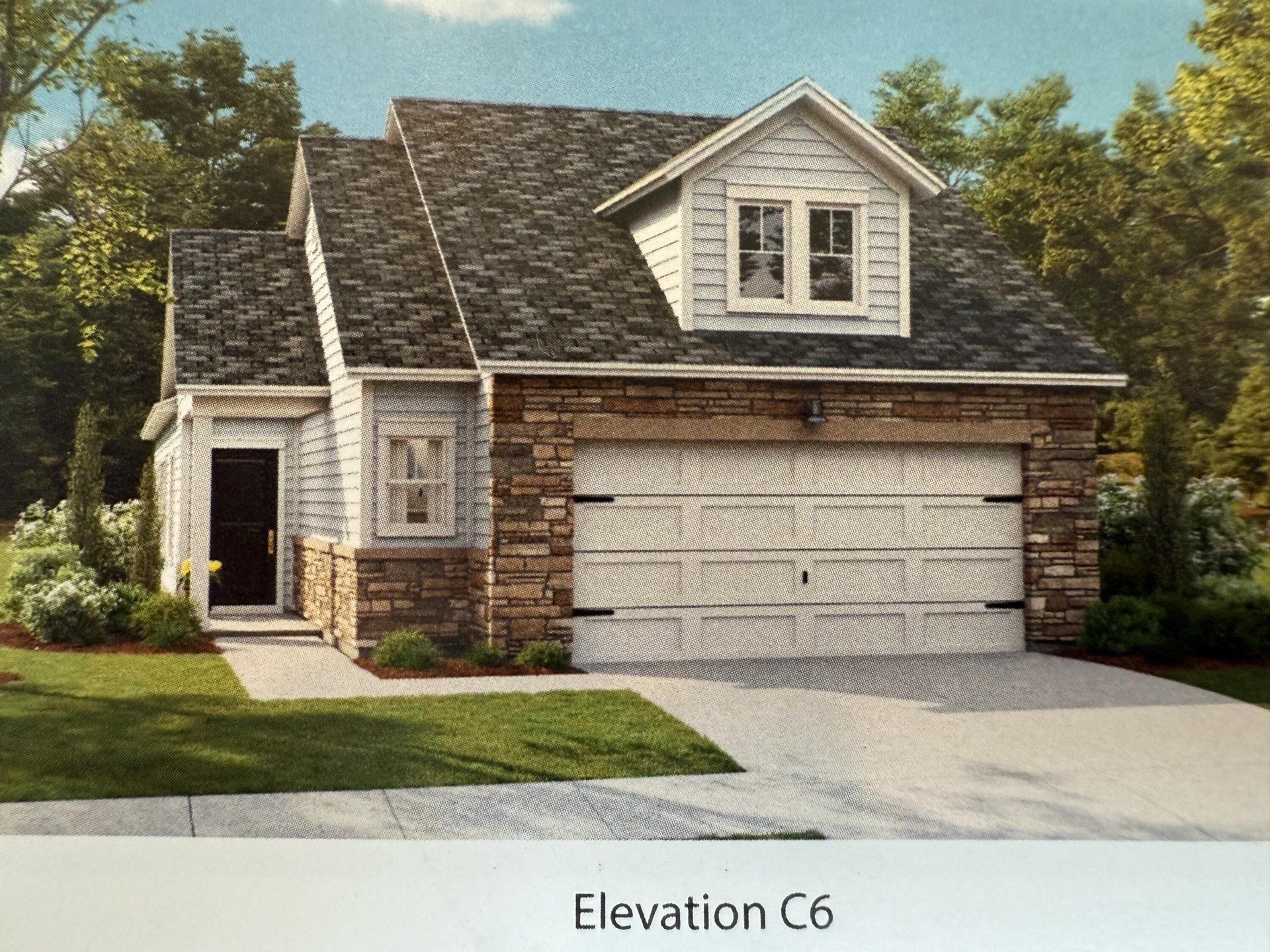 Front exterior of a new home in Horizons at Carnes Crossroads | 55+: Cottage Collection, Summerville, SC, highlighting curb appeal (Image 1). Front exterior of a new home in Horizons at Carnes Crossroads | 55+: Cottage Collection, Summerville, SC, highlighting curb appeal (Image 1).