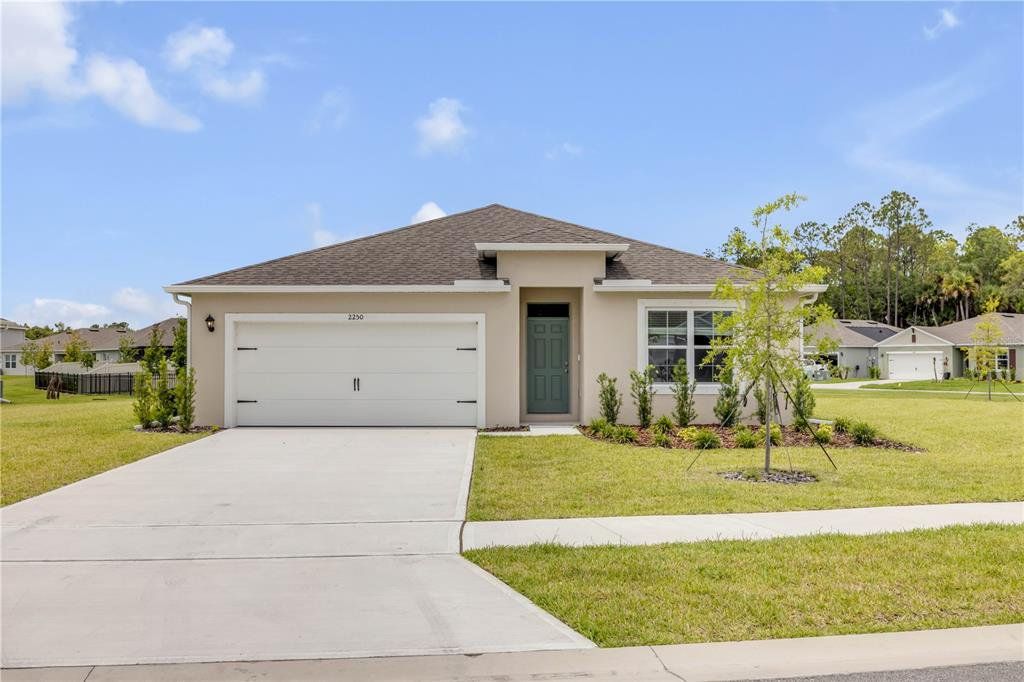 Front exterior of a new home in , New Smyrna Beach, FL, highlighting curb appeal (Image 1). Front exterior of a new home in , New Smyrna Beach, FL, highlighting curb appeal (Image 1).