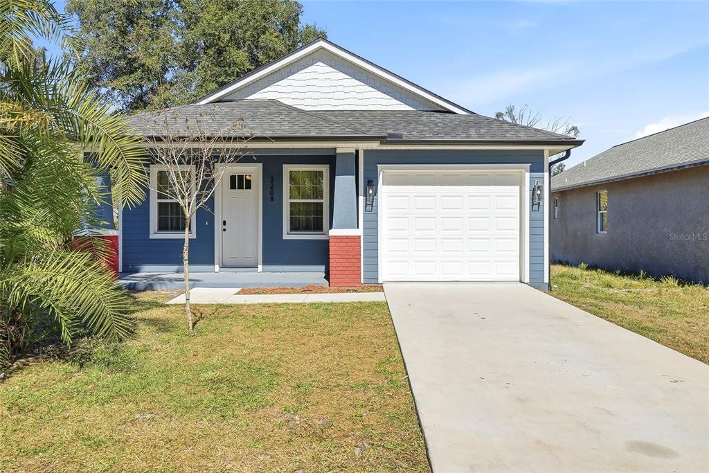 Front exterior of a new home in , Tampa, FL, highlighting curb appeal (Image 1). Front exterior of a new home in , Tampa, FL, highlighting curb appeal (Image 1).