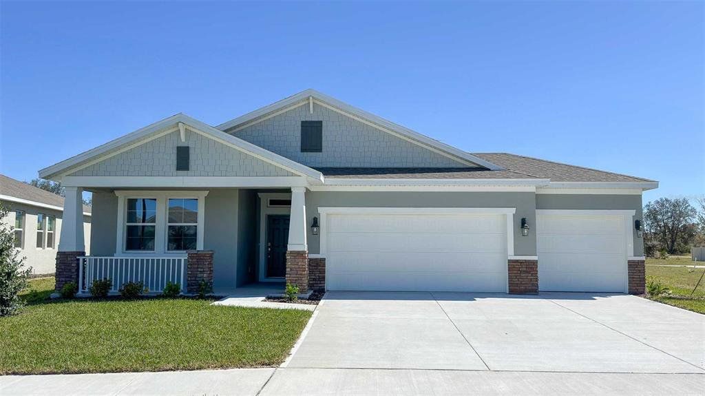 Front exterior of a new home in Archers Mill, Ormond Beach, FL, highlighting curb appeal (Image 1). Front exterior of a new home in Archers Mill, Ormond Beach, FL, highlighting curb appeal (Image 1).