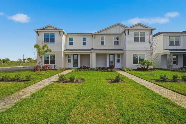Front exterior of a new home in North River Ranch, Parrish, FL, highlighting curb appeal (Image 1). Front exterior of a new home in North River Ranch, Parrish, FL, highlighting curb appeal (Image 1).