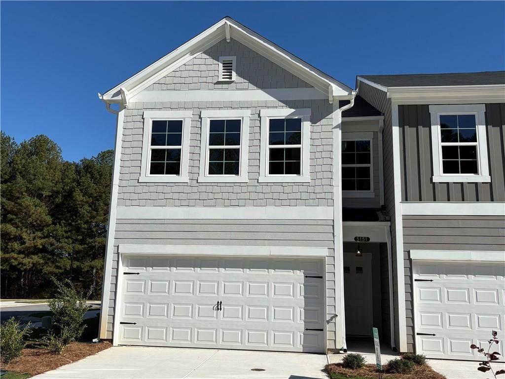 Front exterior of a new home in Longview Run, Decatur, GA, highlighting curb appeal (Image 1). Front exterior of a new home in Longview Run, Decatur, GA, highlighting curb appeal (Image 1).