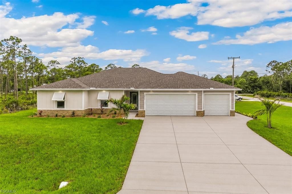Front exterior of a new home in , Punta Gorda, FL, highlighting curb appeal (Image 1). Front exterior of a new home in , Punta Gorda, FL, highlighting curb appeal (Image 1).