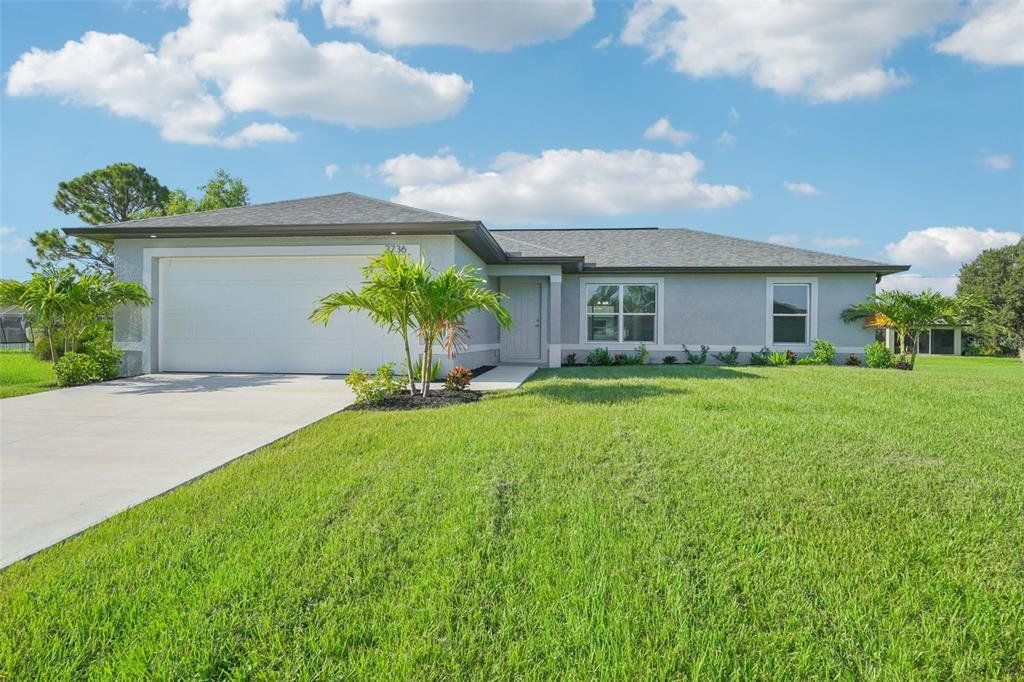 Front exterior of a new home in , Cape Coral, FL, highlighting curb appeal (Image 1). Front exterior of a new home in , Cape Coral, FL, highlighting curb appeal (Image 1).