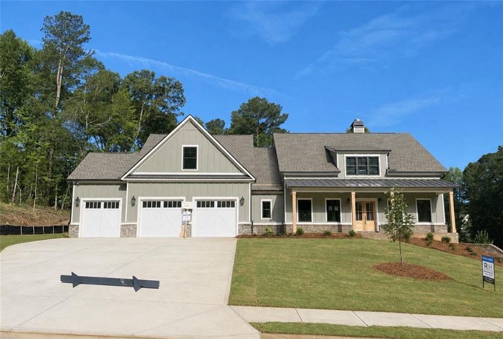 Front exterior of a new home in Spring Creek, Monroe, GA, highlighting curb appeal (Image 1). Front exterior of a new home in Spring Creek, Monroe, GA, highlighting curb appeal (Image 1).