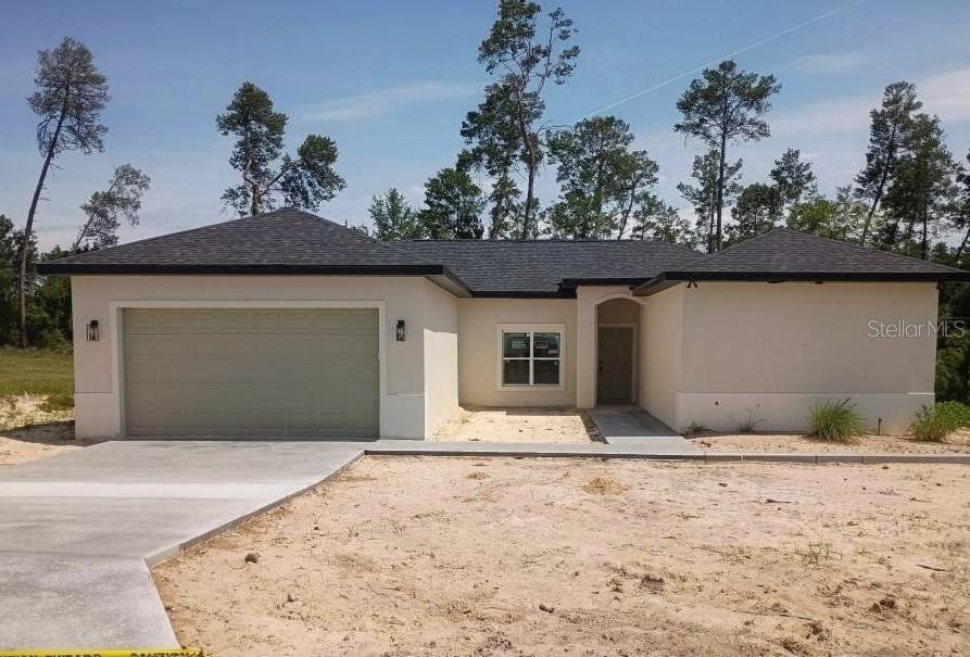 Front exterior of a new home in , Ocala, FL, highlighting curb appeal (Image 1). Front exterior of a new home in , Ocala, FL, highlighting curb appeal (Image 1).