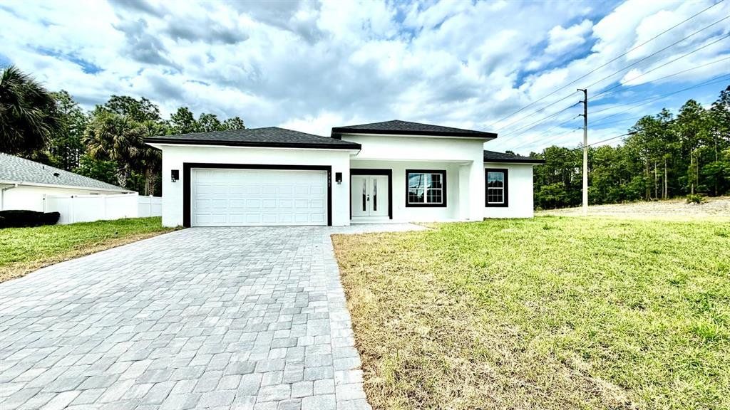 Front exterior of a new home in , Ocala, FL, highlighting curb appeal (Image 1). Front exterior of a new home in , Ocala, FL, highlighting curb appeal (Image 1).