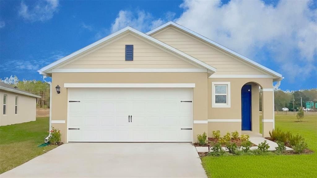 Front exterior of a new home in Wynwood, Ocoee, FL, highlighting curb appeal (Image 1). Front exterior of a new home in Wynwood, Ocoee, FL, highlighting curb appeal (Image 1).