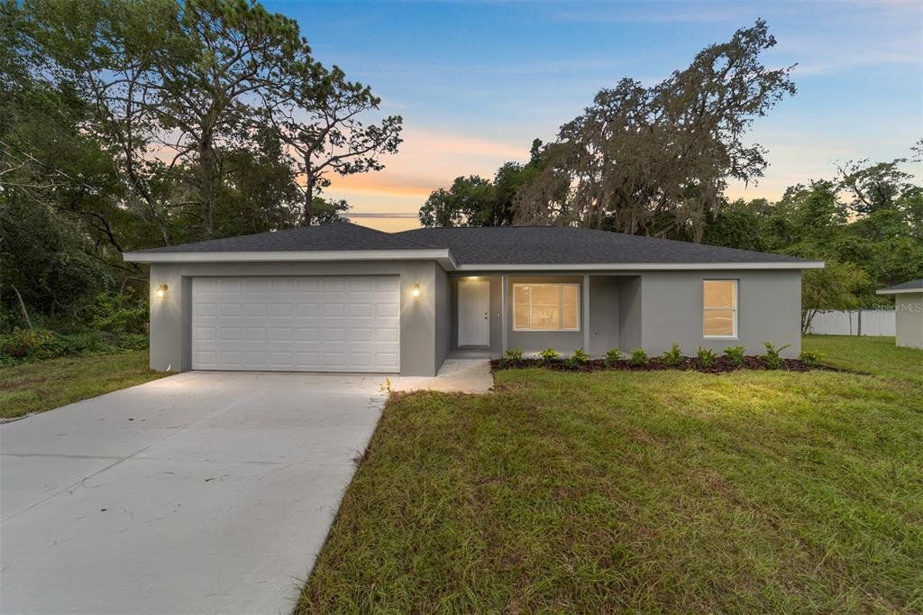 Front exterior of a new home in , Ocklawaha, FL, highlighting curb appeal (Image 1). Front exterior of a new home in , Ocklawaha, FL, highlighting curb appeal (Image 1).