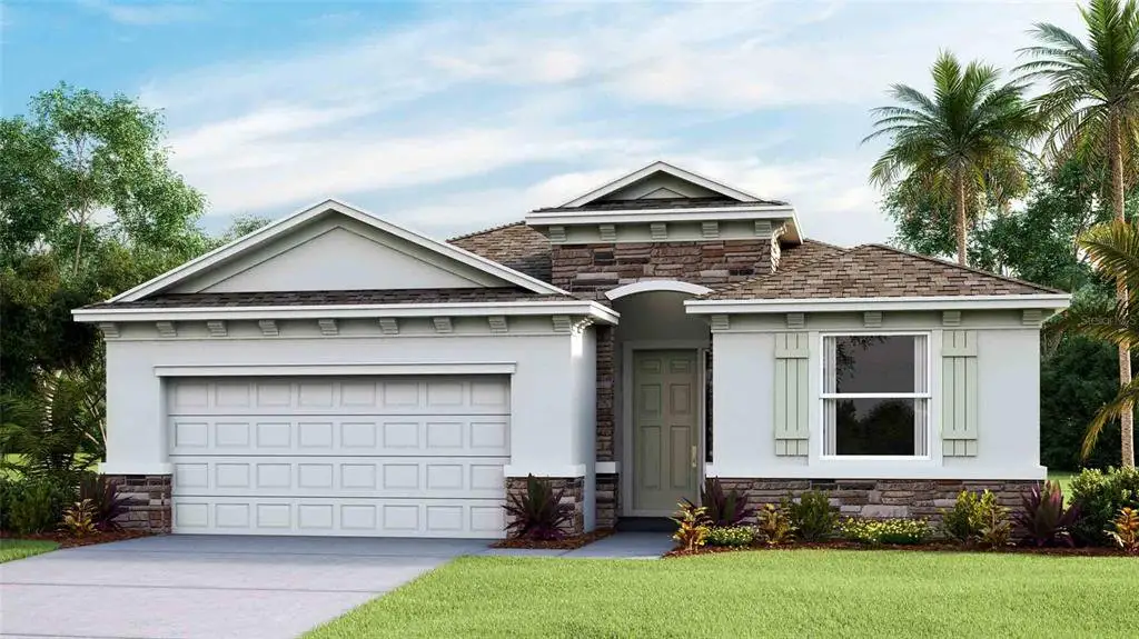 Front exterior of a new home in Woodcreek, Wesley Chapel, FL, highlighting curb appeal (Image 1).
