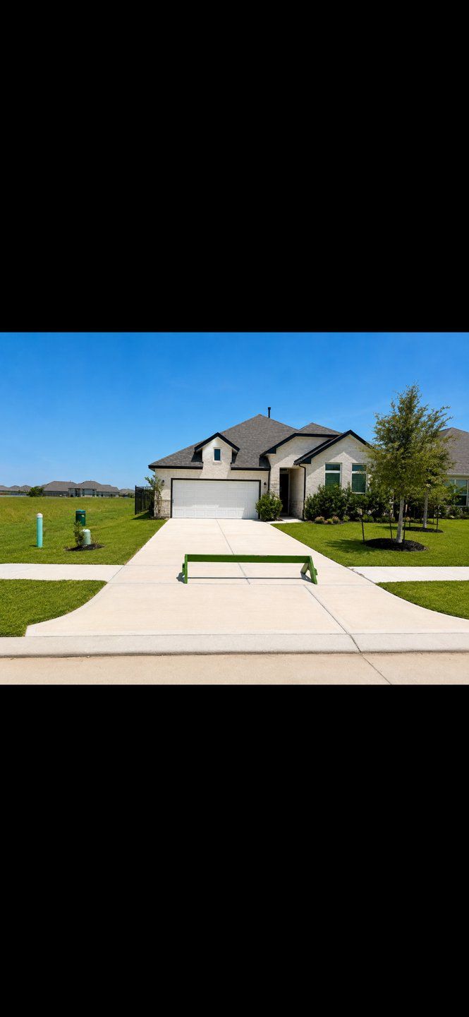 Front exterior of a new home in Lago Mar, La Marque, TX, highlighting curb appeal (Image 1). Front exterior of a new home in Lago Mar, La Marque, TX, highlighting curb appeal (Image 1).