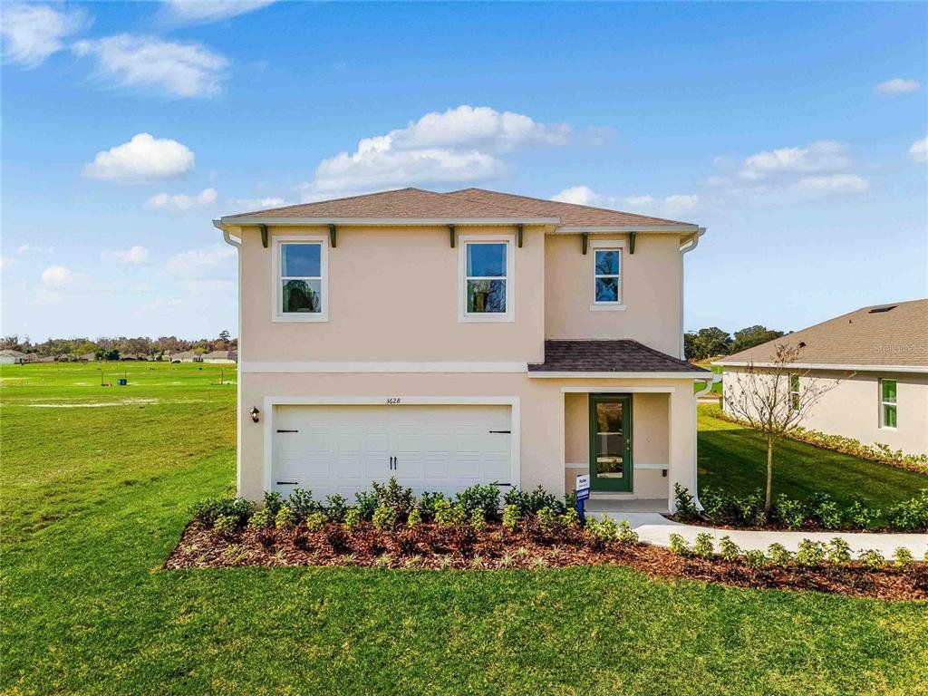 Front exterior of a new home in Concorde, Sanford, FL, highlighting curb appeal (Image 1). Front exterior of a new home in Concorde, Sanford, FL, highlighting curb appeal (Image 1).