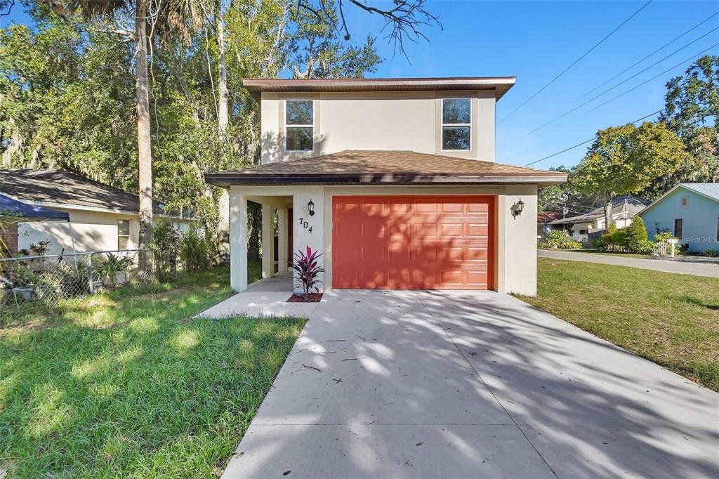 Front exterior of a new home in , Daytona Beach, FL, highlighting curb appeal (Image 1). Front exterior of a new home in , Daytona Beach, FL, highlighting curb appeal (Image 1).