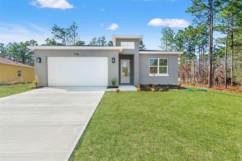 Front exterior of a new home in , Citrus Springs, FL, highlighting curb appeal (Image 1). Front exterior of a new home in , Citrus Springs, FL, highlighting curb appeal (Image 1).
