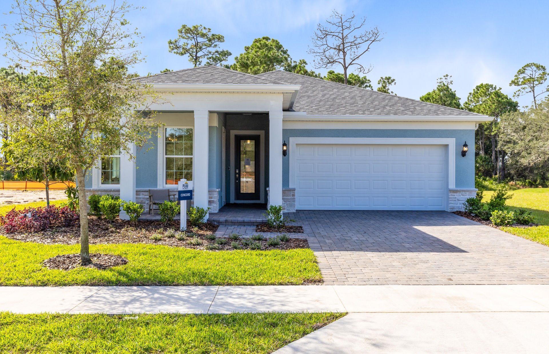 Front exterior of a new home in Waterstone at Halifax Plantation, Ormond Beach, FL, highlighting curb appeal (Image 1). Front exterior of a new home in Waterstone at Halifax Plantation, Ormond Beach, FL, highlighting curb appeal (Image 1).