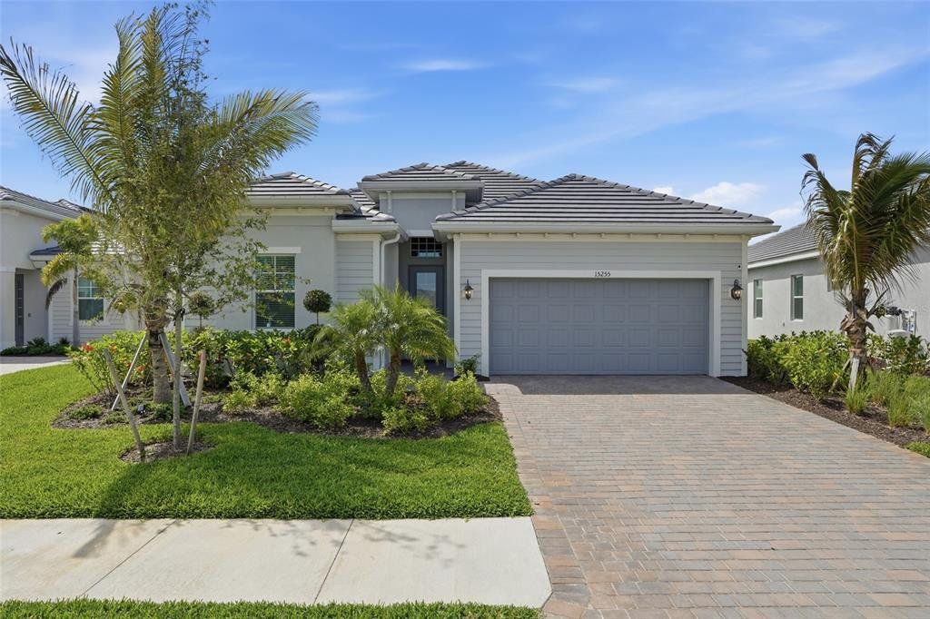 Front exterior of a new home in , Punta Gorda, FL, highlighting curb appeal (Image 1). Front exterior of a new home in , Punta Gorda, FL, highlighting curb appeal (Image 1).