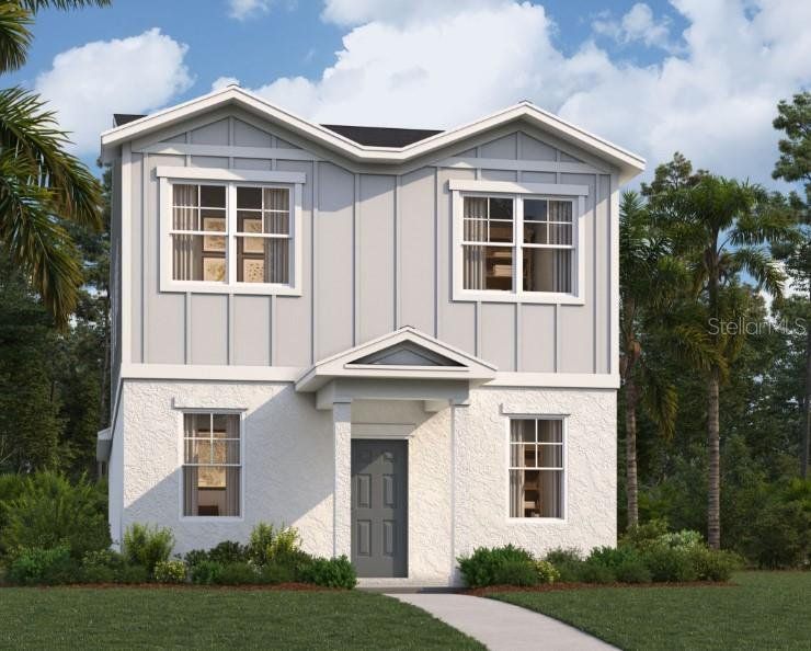 Front exterior of a new home in Spring Walk at the Junction, Debary, FL, highlighting curb appeal (Image 1).
