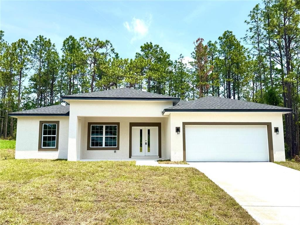 Front exterior of a new home in , Citrus Springs, FL, highlighting curb appeal (Image 1). Front exterior of a new home in , Citrus Springs, FL, highlighting curb appeal (Image 1).