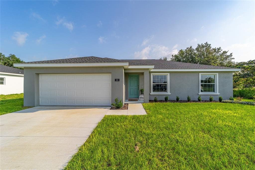 Front exterior of a new home in , Ocala, FL, highlighting curb appeal (Image 1). Front exterior of a new home in , Ocala, FL, highlighting curb appeal (Image 1).