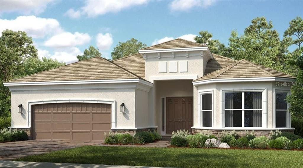 Front exterior of a new home in Esplanade at Artisan Lakes, Palmetto, FL, highlighting curb appeal (Image 1). Front exterior of a new home in Esplanade at Artisan Lakes, Palmetto, FL, highlighting curb appeal (Image 1).