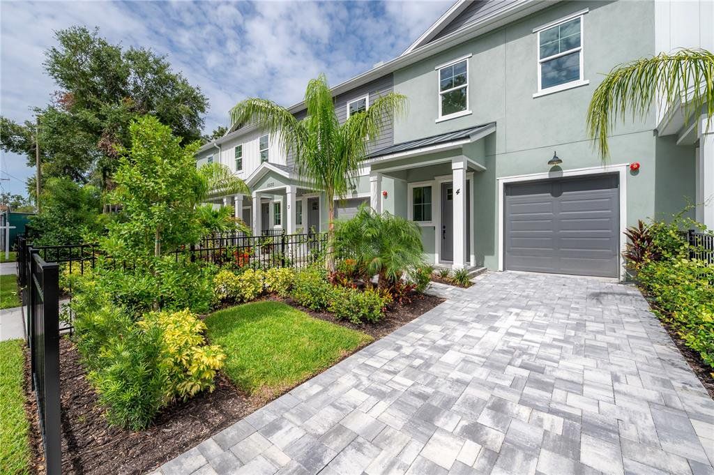 Front exterior of a new home in , Tampa, FL, highlighting curb appeal (Image 1). Front exterior of a new home in , Tampa, FL, highlighting curb appeal (Image 1).