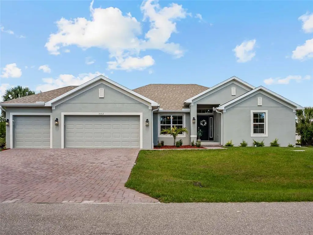 Front exterior of a new home in Port Charlotte, Port Charlotte, FL, highlighting curb appeal (Image 1). Front exterior of a new home in Port Charlotte, Port Charlotte, FL, highlighting curb appeal (Image 1).