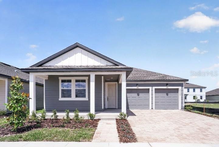 Front exterior of a new home in Trailside, Mount Dora, FL, highlighting curb appeal (Image 1). Front exterior of a new home in Trailside, Mount Dora, FL, highlighting curb appeal (Image 1).