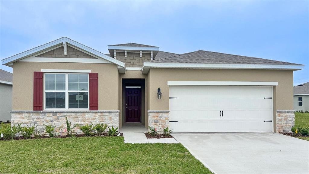 Front exterior of a new home in Archers Mill, Ormond Beach, FL, highlighting curb appeal (Image 1). Front exterior of a new home in Archers Mill, Ormond Beach, FL, highlighting curb appeal (Image 1).