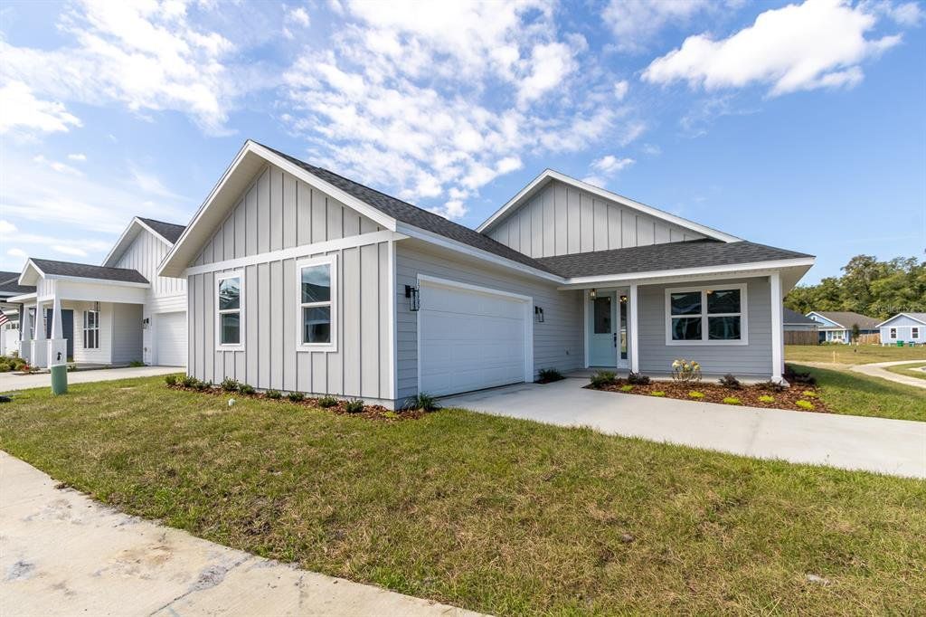 Front exterior of a new home in , Alachua, FL, highlighting curb appeal (Image 1). Front exterior of a new home in , Alachua, FL, highlighting curb appeal (Image 1).
