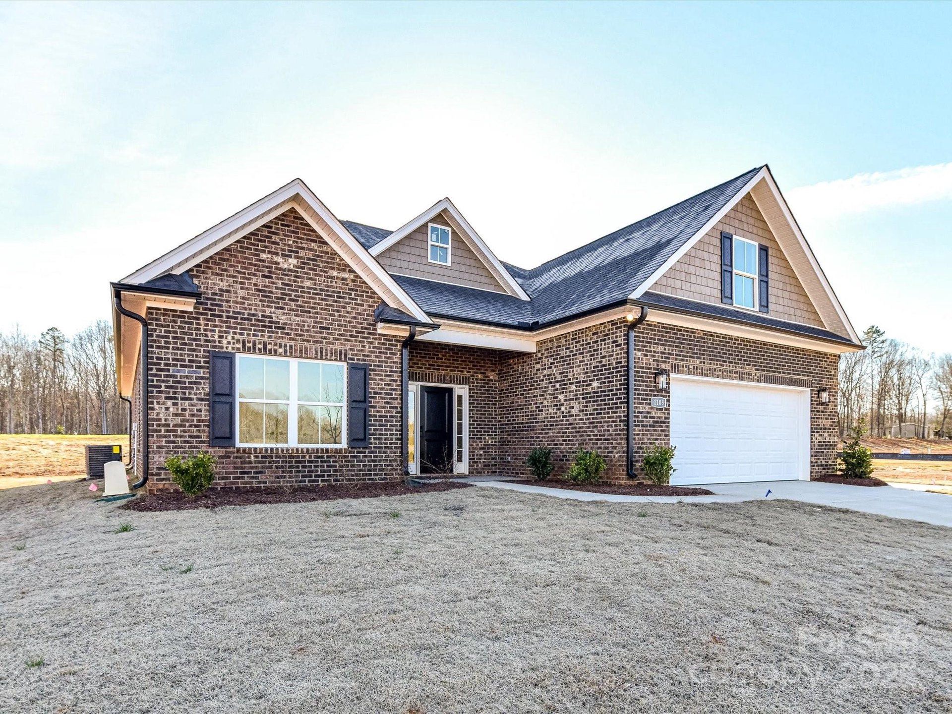 Front exterior of a new home in , Waxhaw, NC, highlighting curb appeal (Image 1).