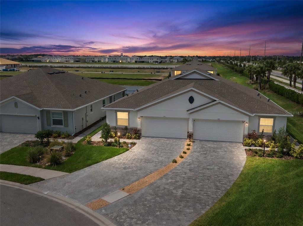 Front exterior of a new home in Star Farms at Lakewood Ranch, Lakewood Ranch, FL, highlighting curb appeal (Image 1). Front exterior of a new home in Star Farms at Lakewood Ranch, Lakewood Ranch, FL, highlighting curb appeal (Image 1).