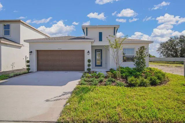 Front exterior of a new home in Fieldstone, Plant City, FL, highlighting curb appeal (Image 1). Front exterior of a new home in Fieldstone, Plant City, FL, highlighting curb appeal (Image 1).