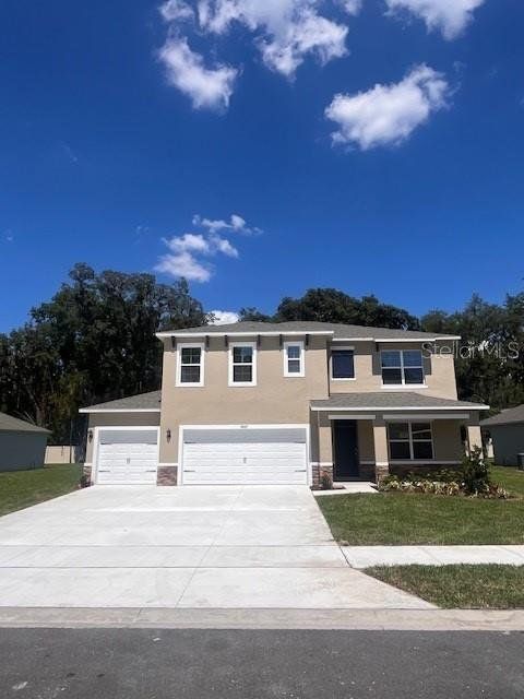 Front exterior of a new home in Bradbury Estates, Sanford, FL, highlighting curb appeal (Image 1). Front exterior of a new home in Bradbury Estates, Sanford, FL, highlighting curb appeal (Image 1).