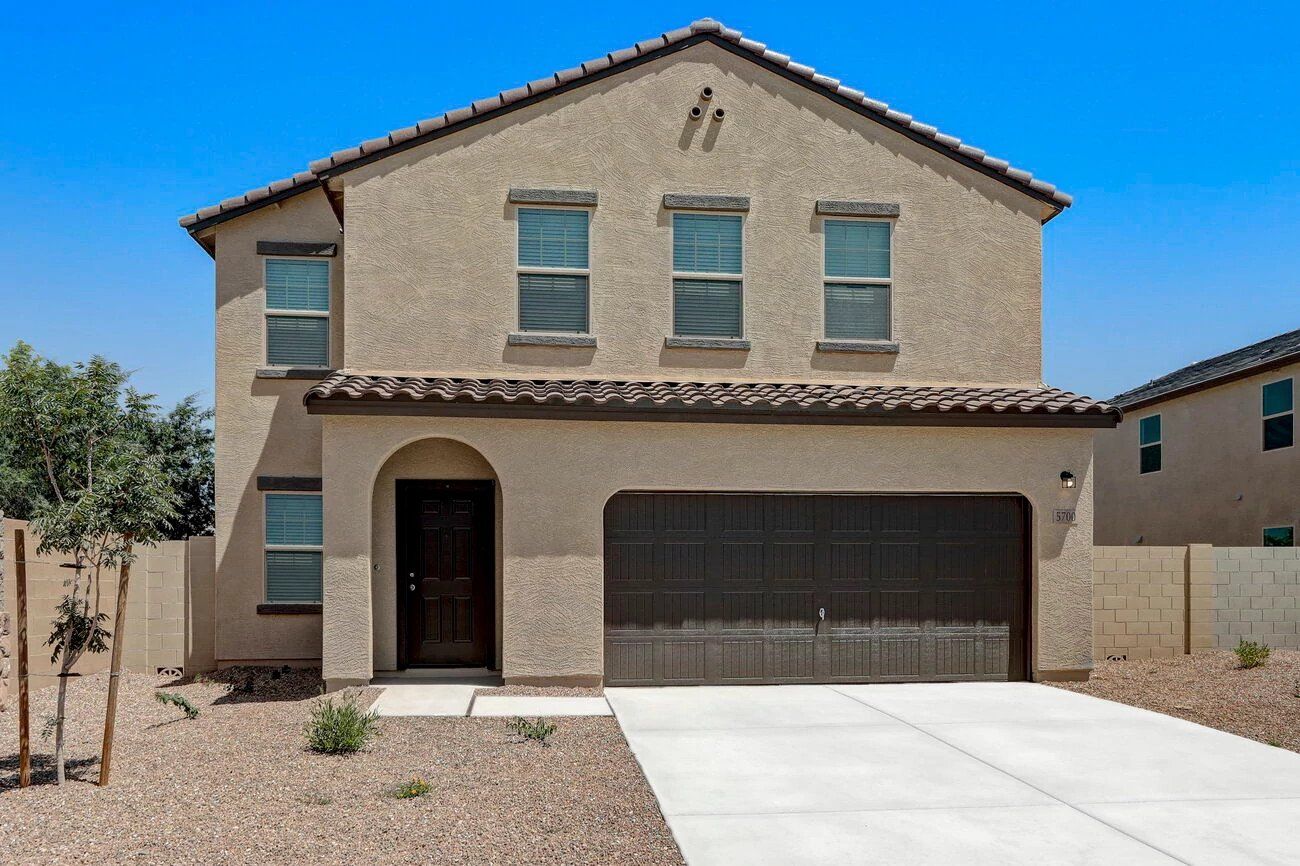 Front exterior of a new home in Magic Ranch, Florence, AZ, highlighting curb appeal (Image 1). Front exterior of a new home in Magic Ranch, Florence, AZ, highlighting curb appeal (Image 1).
