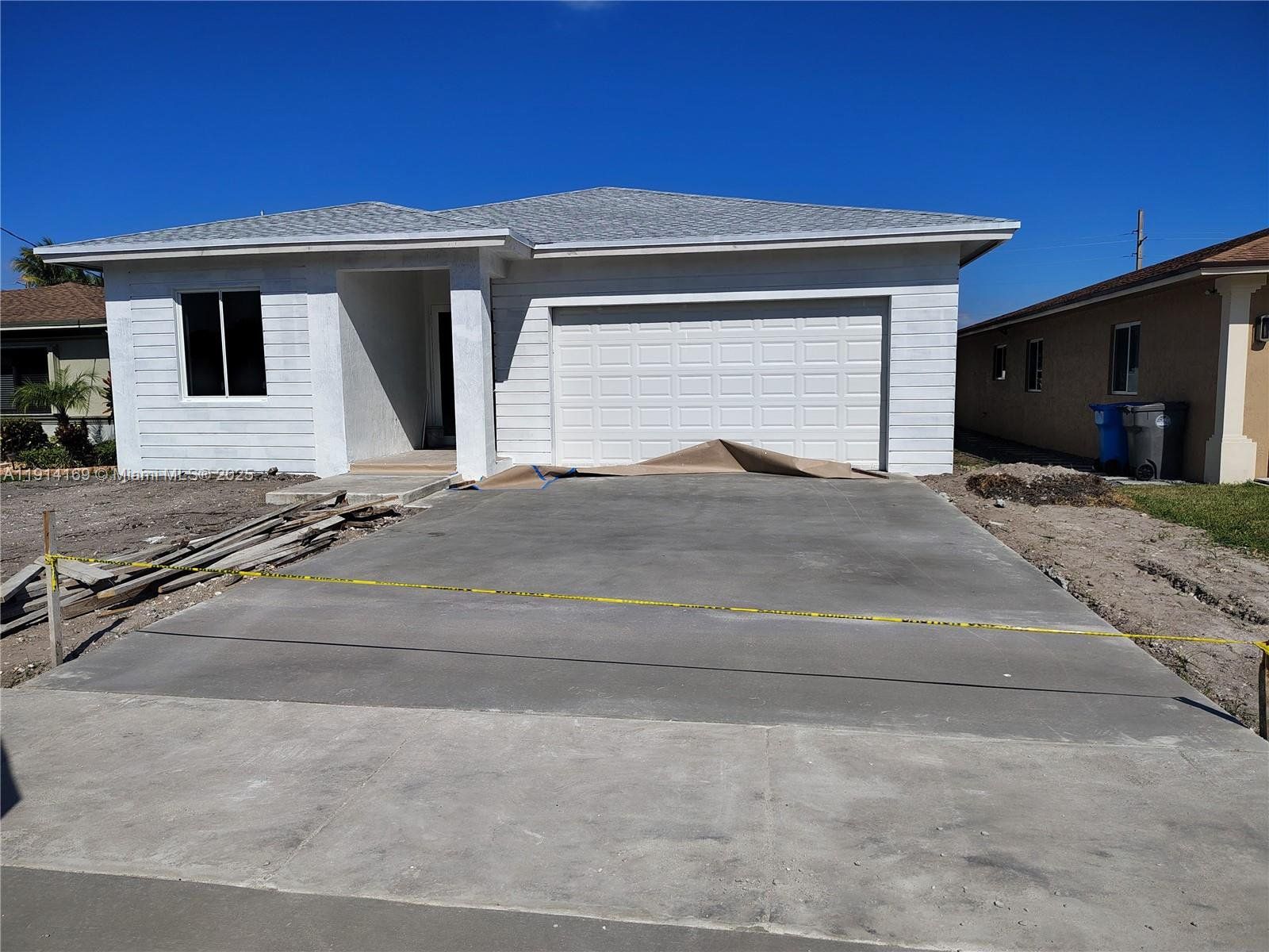 In-progress construction of a new home in , West Park, FL (Image 1).