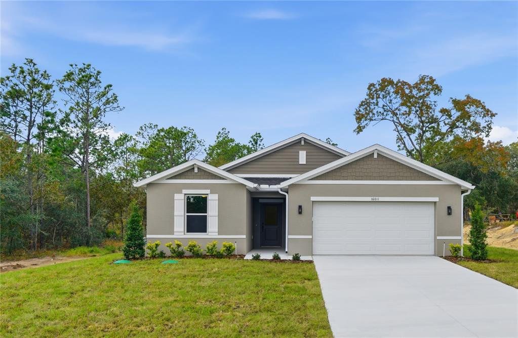 Front exterior of a new home in , Weeki Wachee, FL, highlighting curb appeal (Image 1). Front exterior of a new home in , Weeki Wachee, FL, highlighting curb appeal (Image 1).