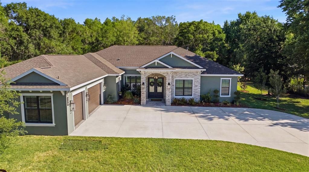 Front exterior of a new home in , Tarpon Springs, FL, highlighting curb appeal (Image 1). Front exterior of a new home in , Tarpon Springs, FL, highlighting curb appeal (Image 1).