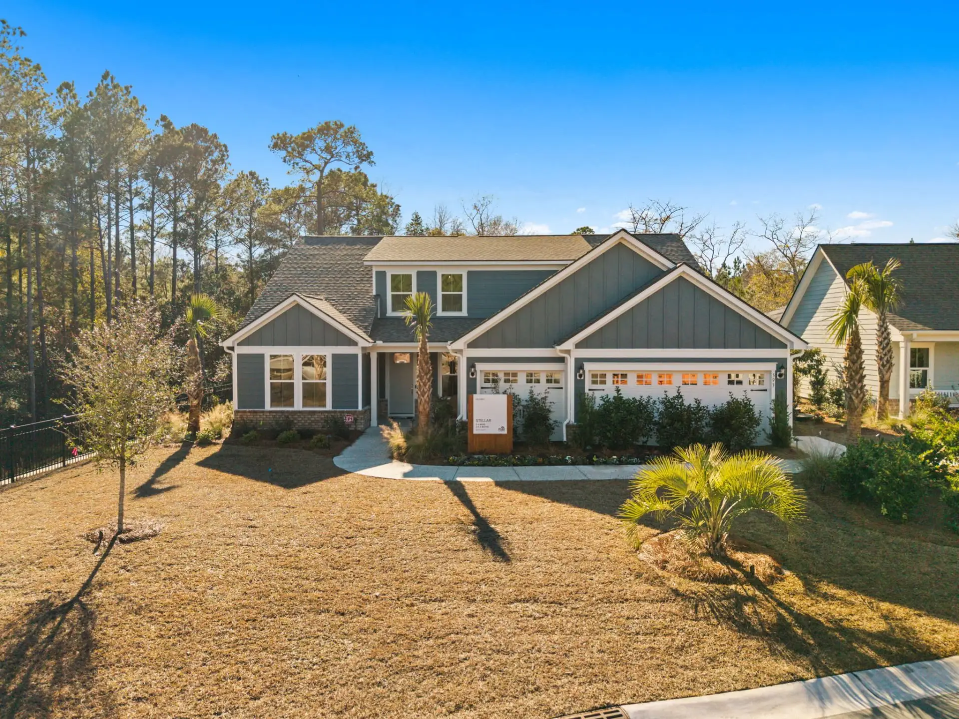 Front exterior of a new home in Solserra, Shallotte, NC, highlighting curb appeal (Image 1). Front exterior of a new home in Solserra, Shallotte, NC, highlighting curb appeal (Image 1).