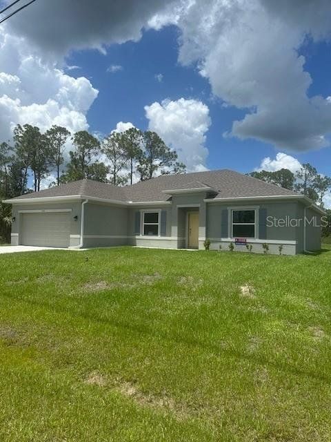 Front exterior of a new home in , North Port, FL, highlighting curb appeal (Image 1). Front exterior of a new home in , North Port, FL, highlighting curb appeal (Image 1).